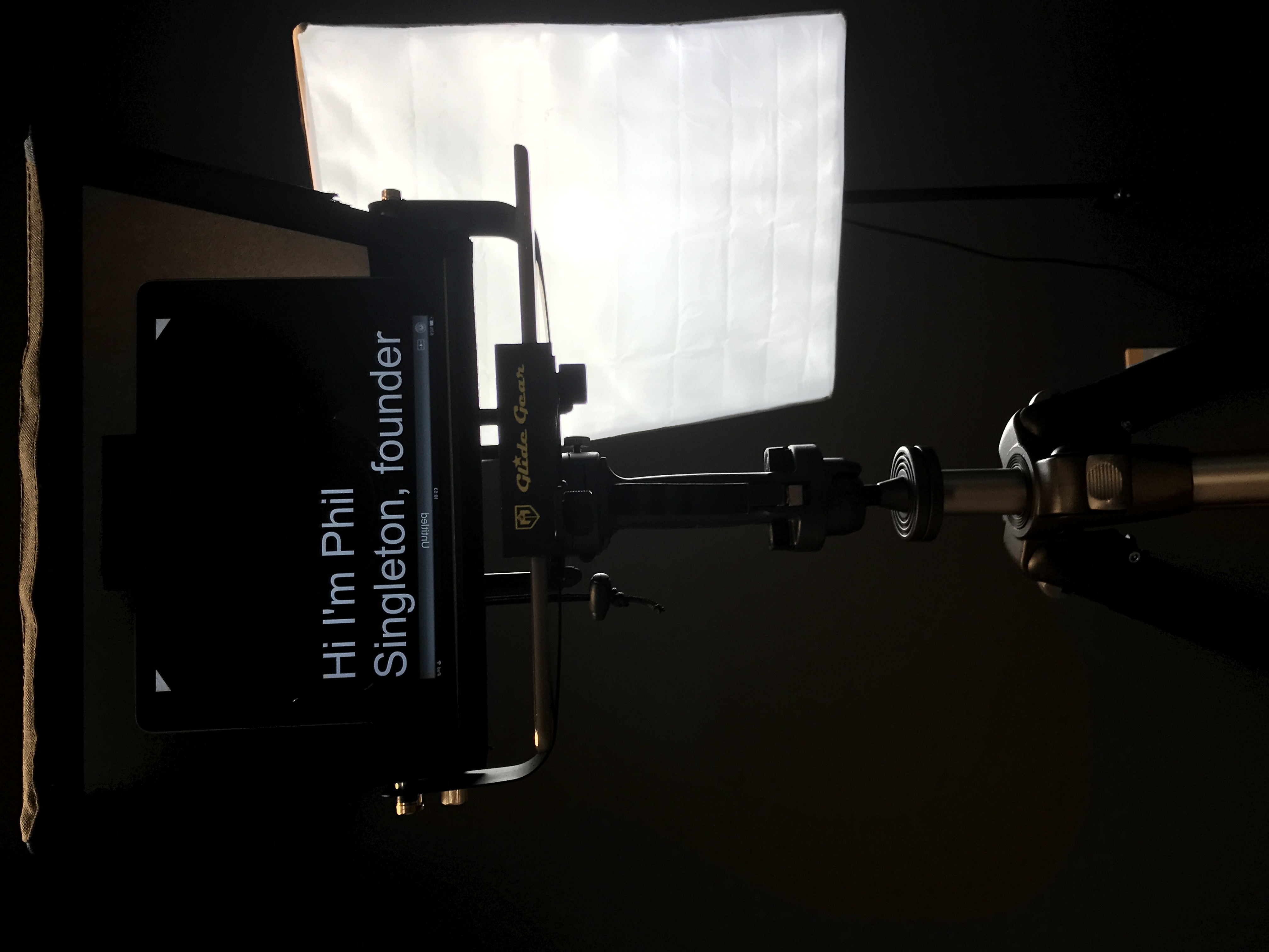 Teleprompter displaying Phil Singleton's introduction beside the production lighting